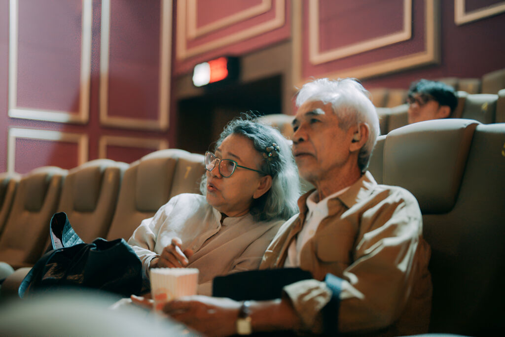 Senior citizens watching a movie at the cinema with senior citizen rate
