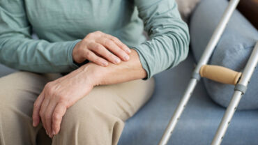 Image of an elderly person having joint pains, also known as arthritis