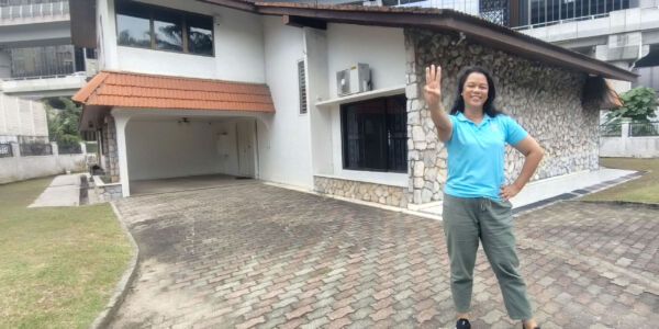 The founder of Oretha's Senior Care, Oretha, standing in front of the third senior daycare at Damansara Heights, Kuala Lumpur.
