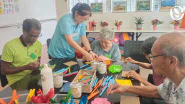 Seniors doing cognitive activities together at the senior daycare