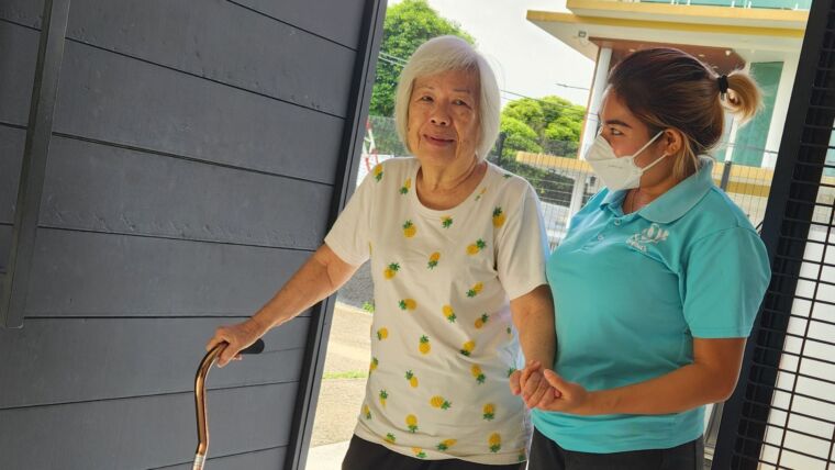 Image of an elderly senior arriving at Oretha's Senior Daycare via arranged transportation