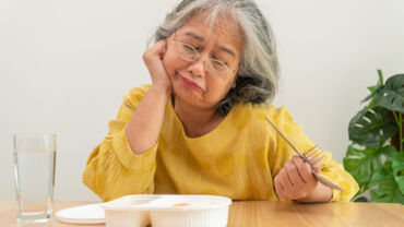 Senior woman having loss of appetite and become unhappy