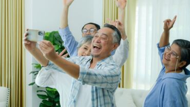 Image of a group of elderly people enjoying and having fun together at the senior daycare