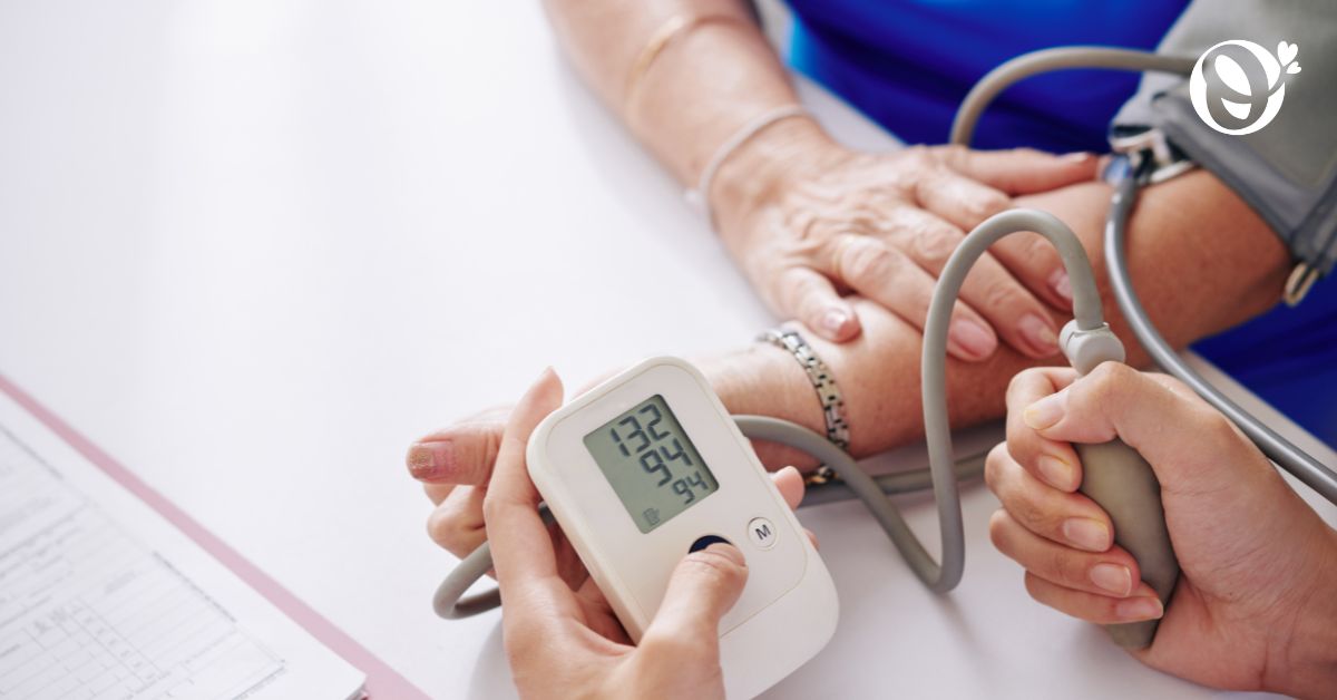 Image of an elderly woman taking her blood pressure reading