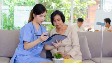 Doctor assisting an elderly woman on advance directives planning