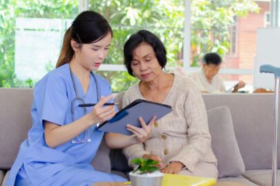 Doctor assisting an elderly woman on advance directives planning