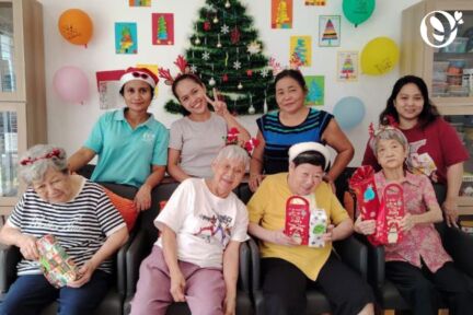 Seniors holding their gifts during Christmas celebration at the senior daycare in Taman Billion, Cheras