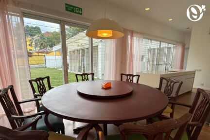 Spacious dining area at the senior daycare, overlooking a beautiful lush garden.