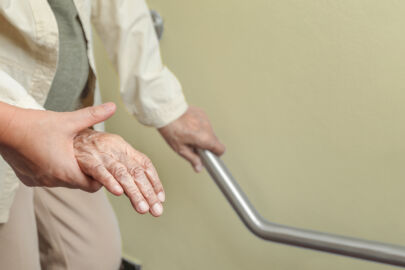 Senior concierge assisting an elderly during post-hospital recovery visit